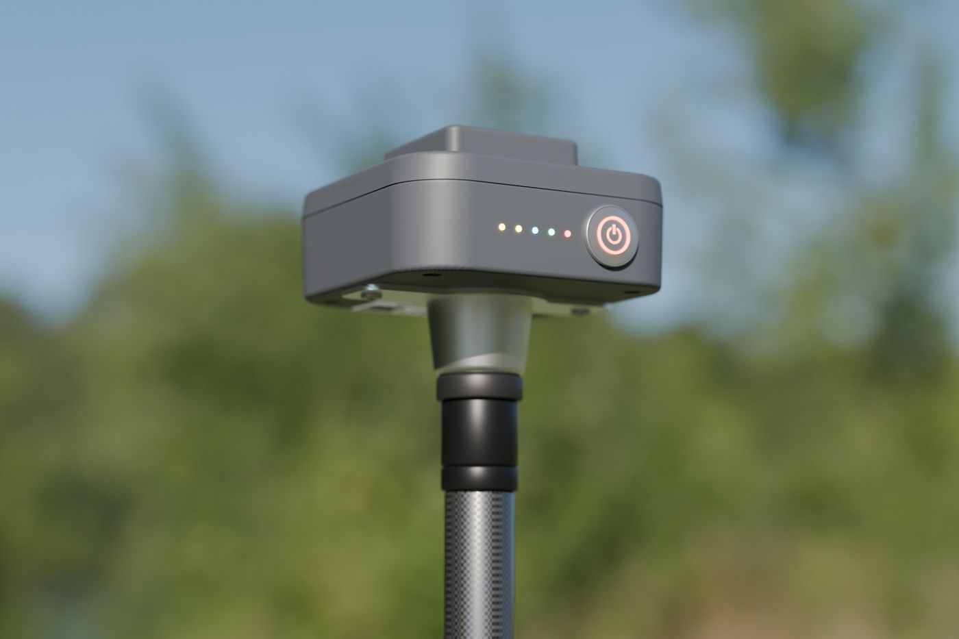 Compact GNSS rover receiver on a carbon survey pole